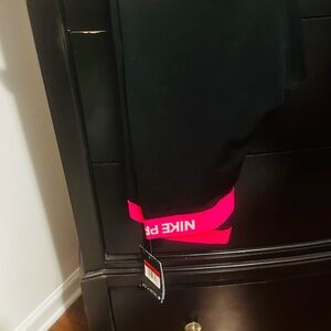 Nike Black Leggings with Vibrant Pink Accents